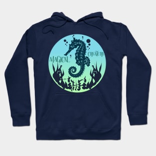 The sea once it casts its spell,  holds one in its net of wonder. Seahorse magic. Hoodie